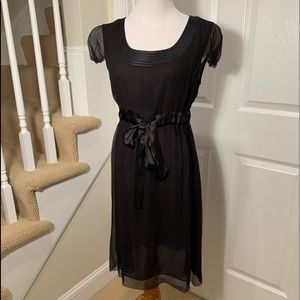 Perfect condition. Black silk dress. Tie detail
